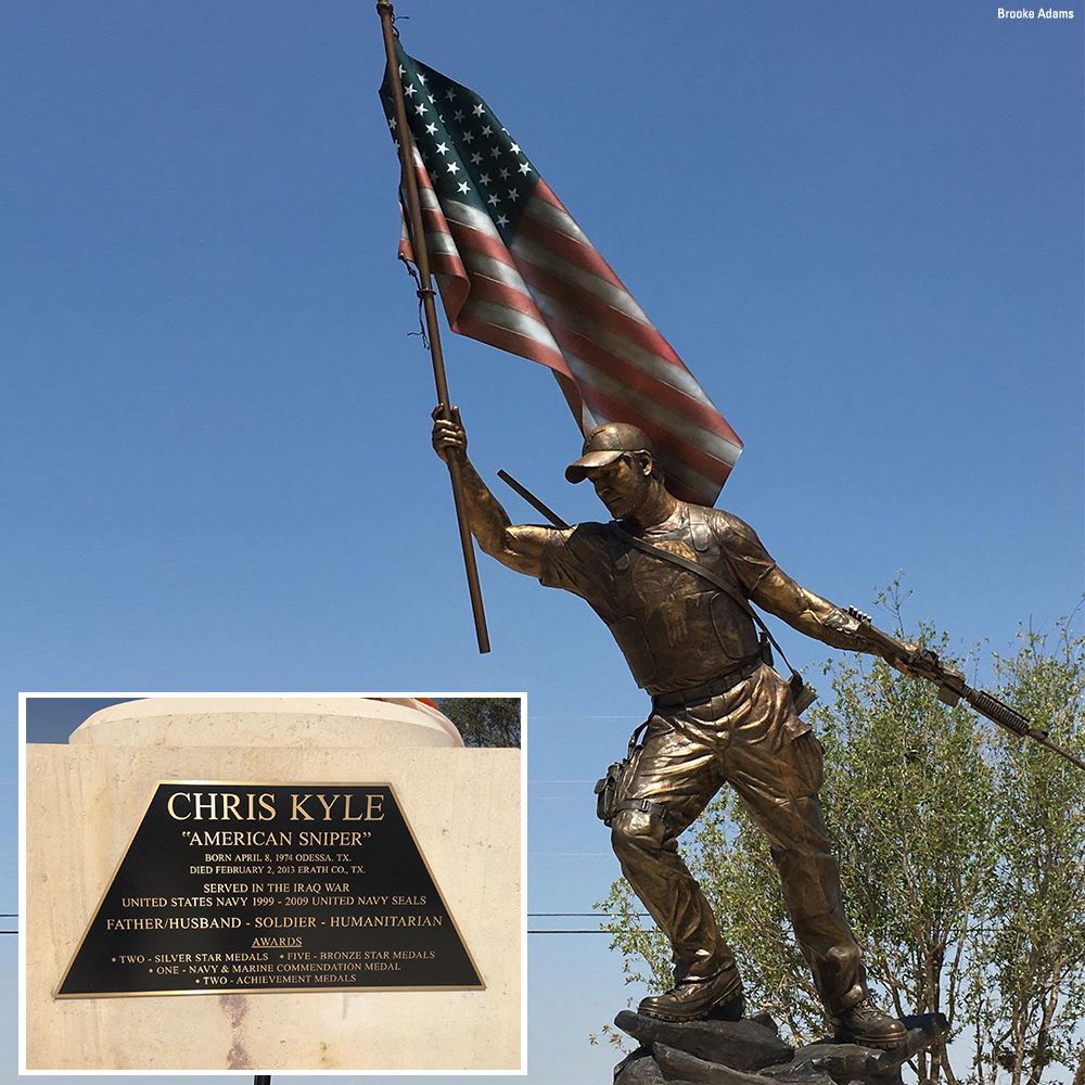 Statue of a soldier holding an American flag.
